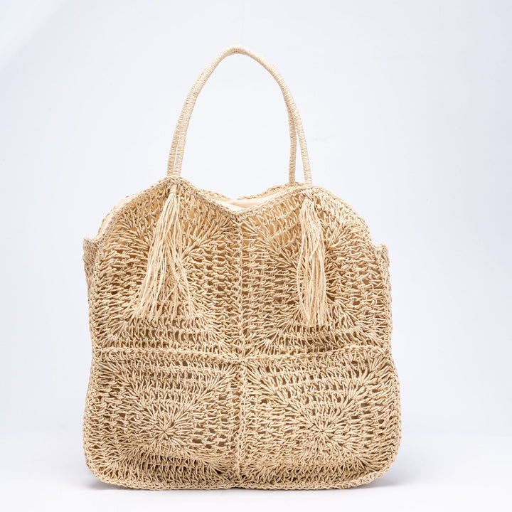Handcrafted straw beach bag with decorative fringes Kalsten