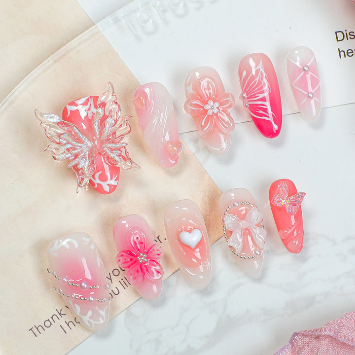 Creative print nail set with floral designs and decorative accents Kalsten
