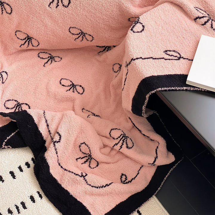 Reversible cuddly blanket made of terry cloth with decorative dog motif