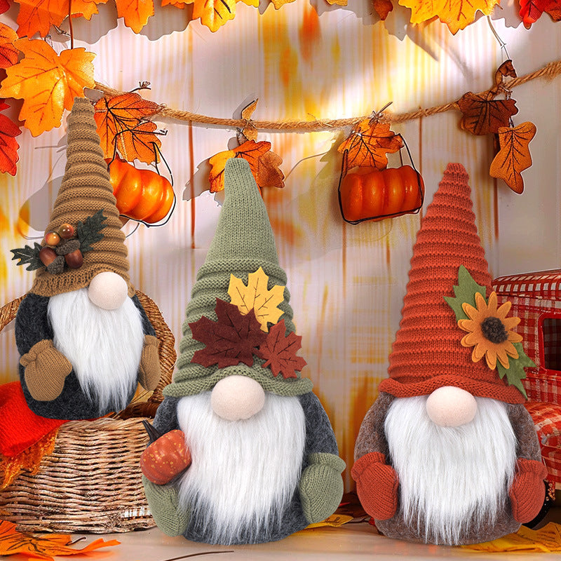 Autumn handmade decorative gnome figure with knitted hat, felt leaf application and pumpkin detail