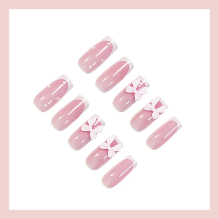 Glamorous artificial nail set with elegant bows and glitter accents Kalsten