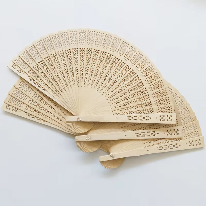 Ladies fan made of delicate plastic with artistic cut pattern Kalsten