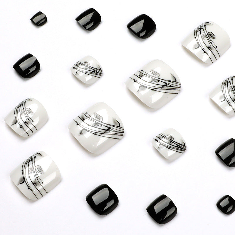 Artful toenail art in elegant black and white design Kalsten