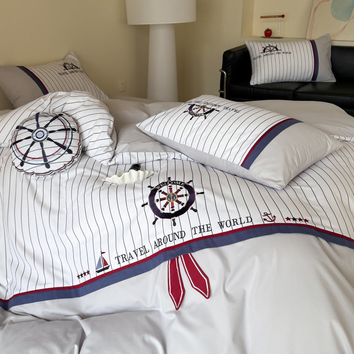 Maritime bedding set made of cotton satin with embroidered steering wheel and fine pinstripes