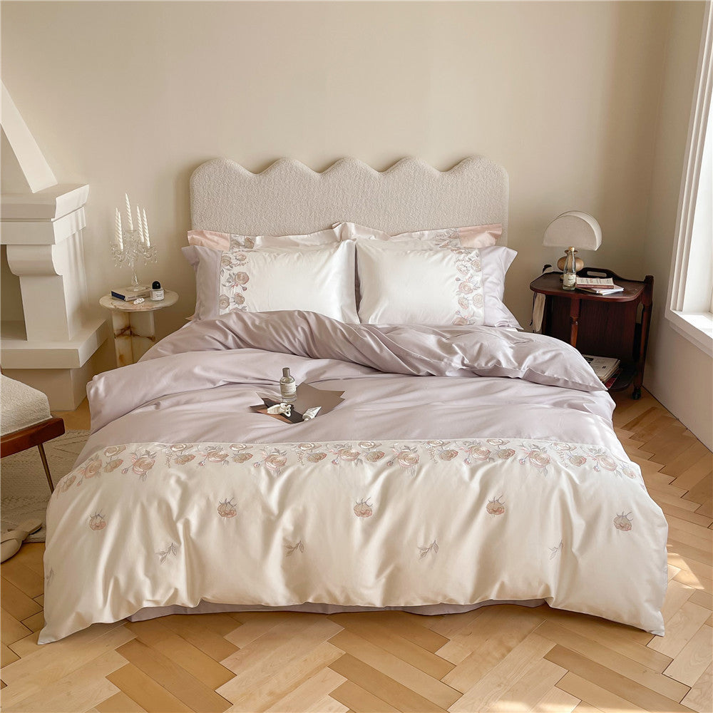 Premium bedding set made of cotton satin with floral border embroidery and reversible function
