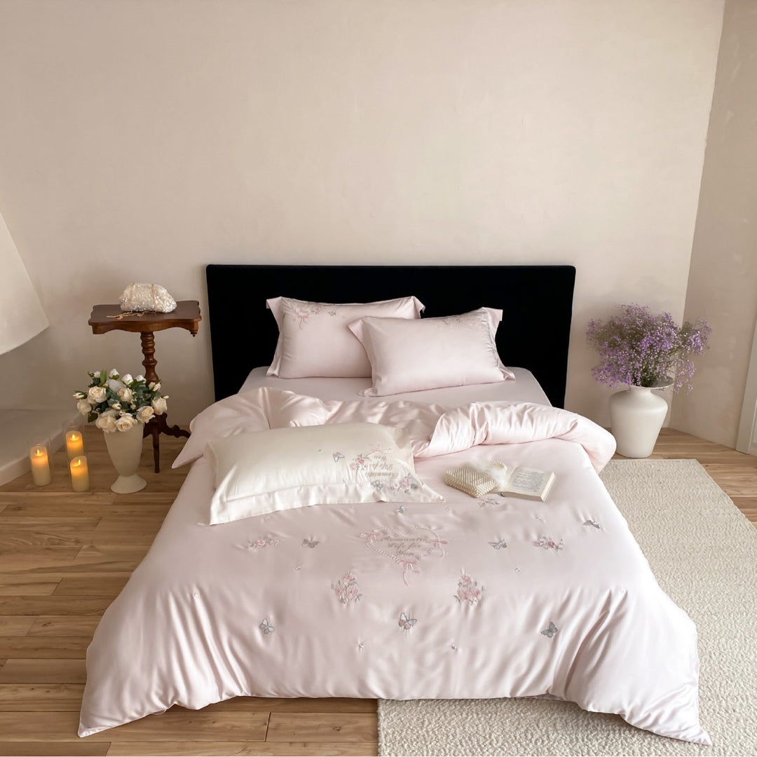 Luxurious embroidered cotton satin bedding set with delicate butterfly and flower appliqués