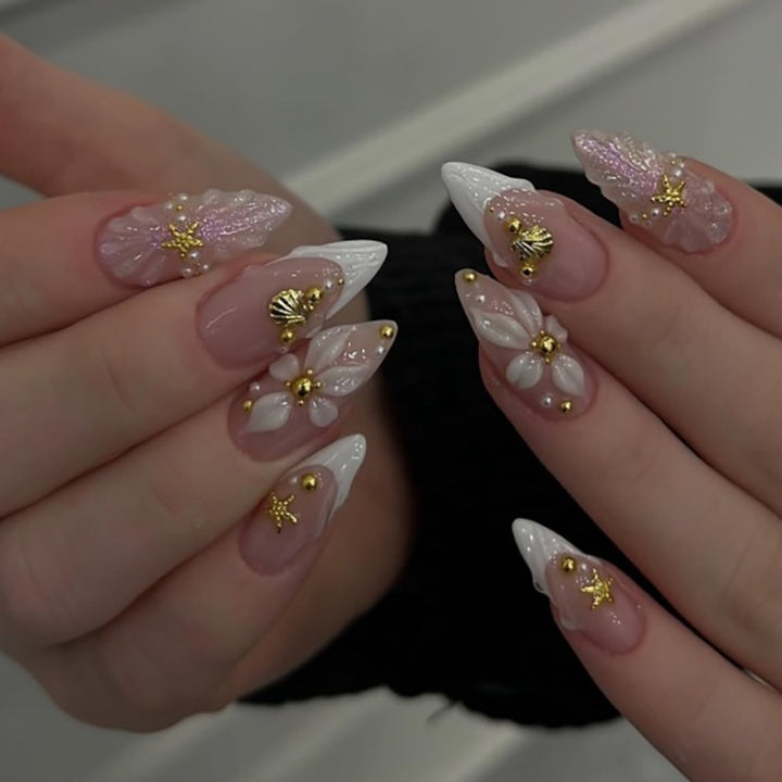 Artful nail art with shell and flower accents Kalsten