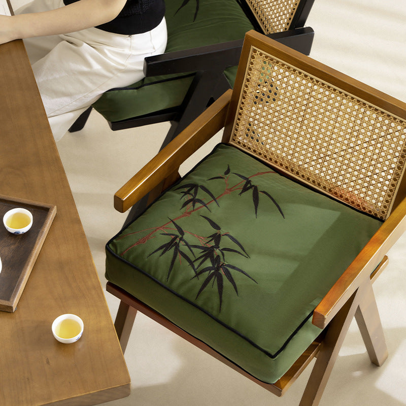 Extra-thick chair cushion with embroidered bamboo design and removable cover