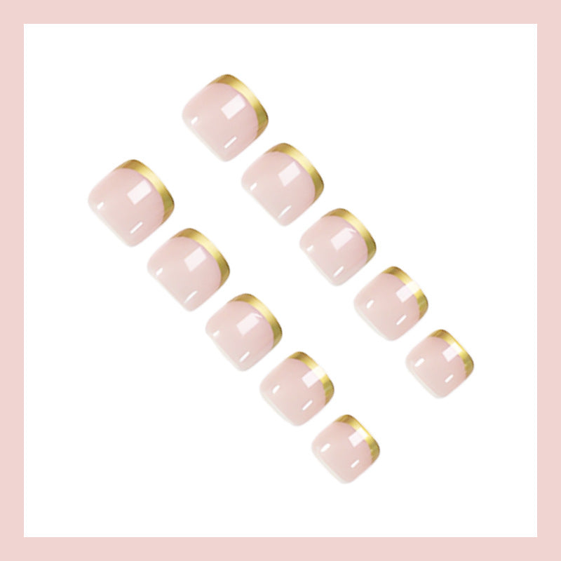 Toenail art set with elegant gold tips and delicate embellishments Kalsten