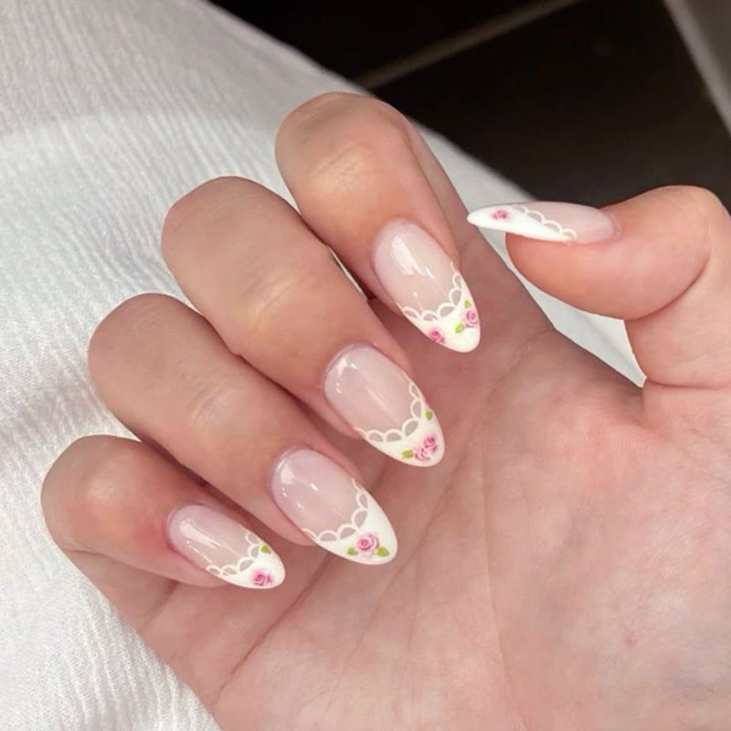 Artful Nail Art with Flower Design and Blue French Tip Kalsten