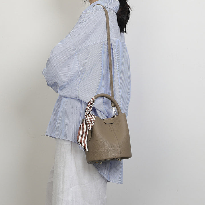 Chic Handheld Bucket Bag with Braided Accent