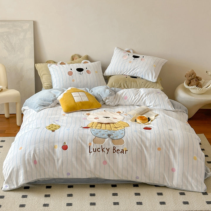 Children's bedding set with three-dimensional ear appliqué and embroidered bear motif