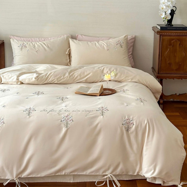 Luxurious satin bedding set with delicate pearl flower embroidery and tie ribbons