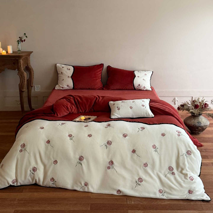 Embroidered bedding set with rose embroidery and contrasting piping