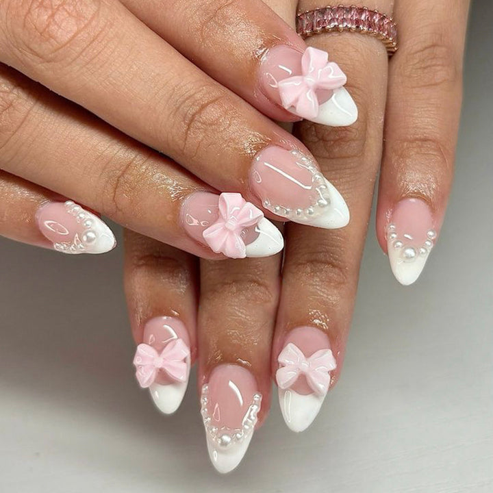 Artificial nail art with playful dots and bows Kalsten