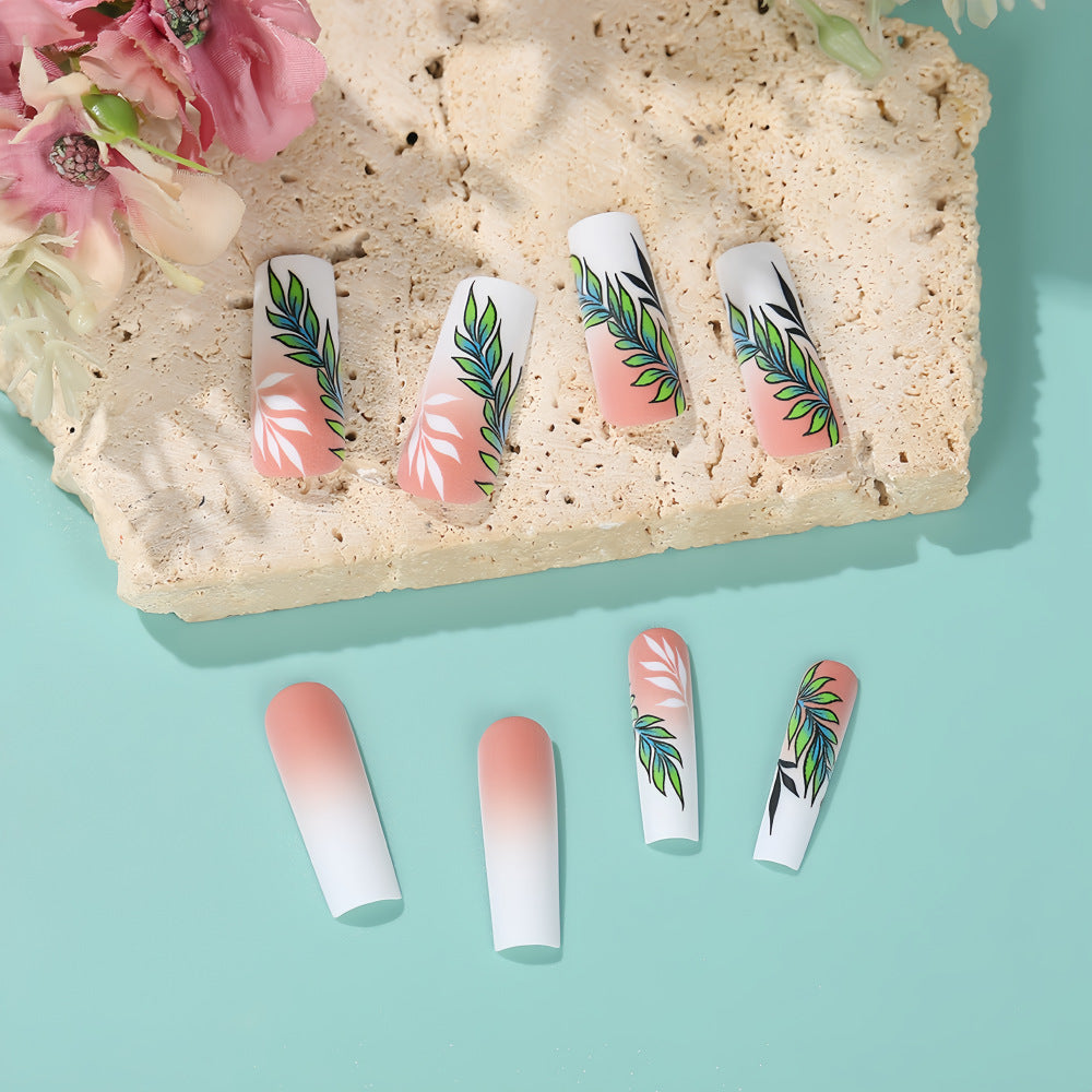 Artificial nails with elegant ombre design and floral accents Kalsten