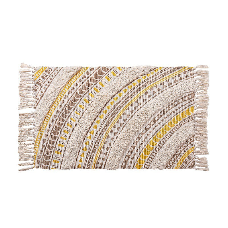 Flat Boho runner rug made of cotton blend fabric with geometric hexagon tufting and decorative fringed edge.