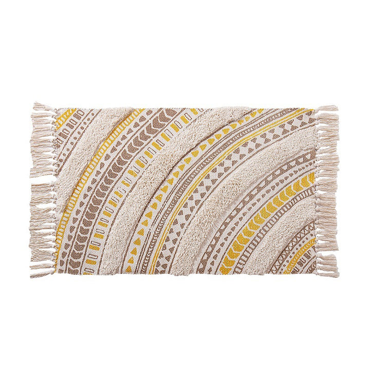 Flat Boho runner rug made of cotton blend fabric with geometric hexagon tufting and decorative fringed edge.