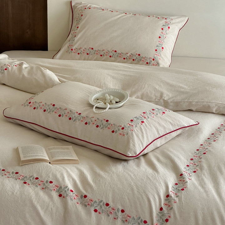 High-quality cotton-linen bed linen set with fine floral embroidery and piping edge