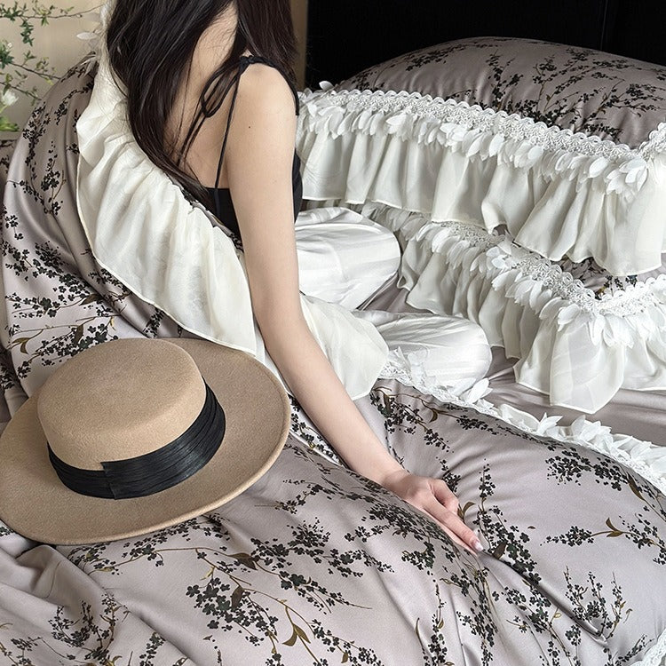 Satin bedding set with floral print duvet, tiered ruffle pillow & lace trim