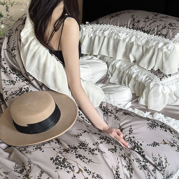 Satin bedding set with floral print duvet, tiered ruffle pillow & lace trim