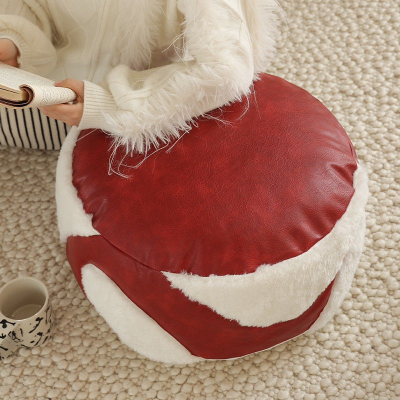 Round seating pouf with faux leather cover and Sherpa applications