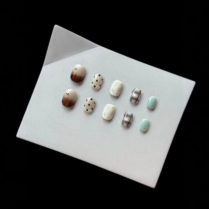 Artistic Press-On Nail Art Set with Elegant Floral and Polka Dot Designs