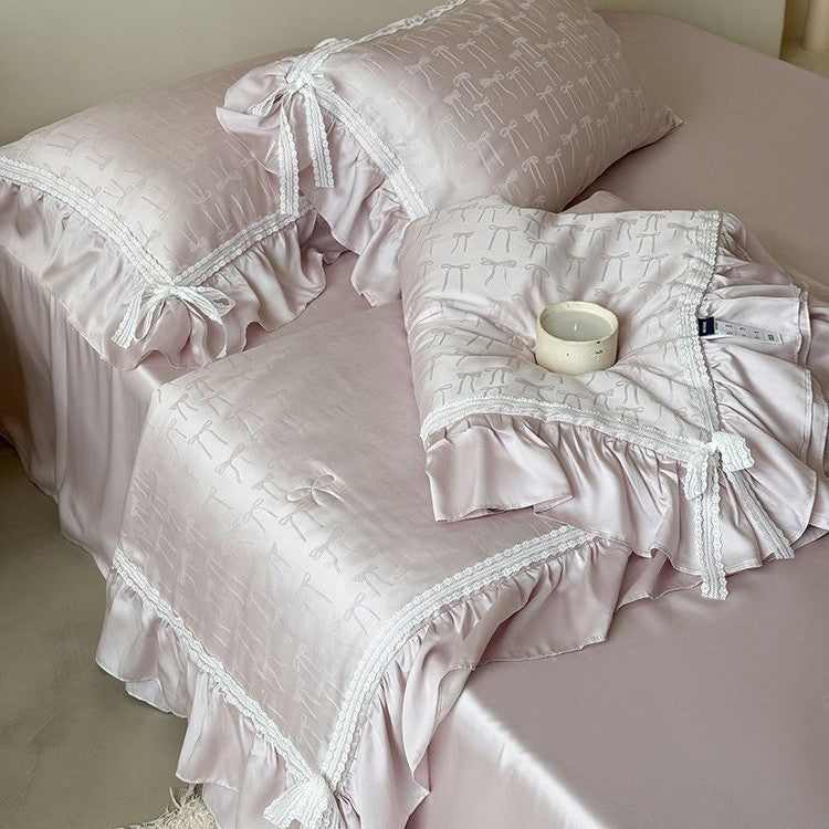 Satin bedding set with jacquard bow relief, gathered ruffle and lace trim