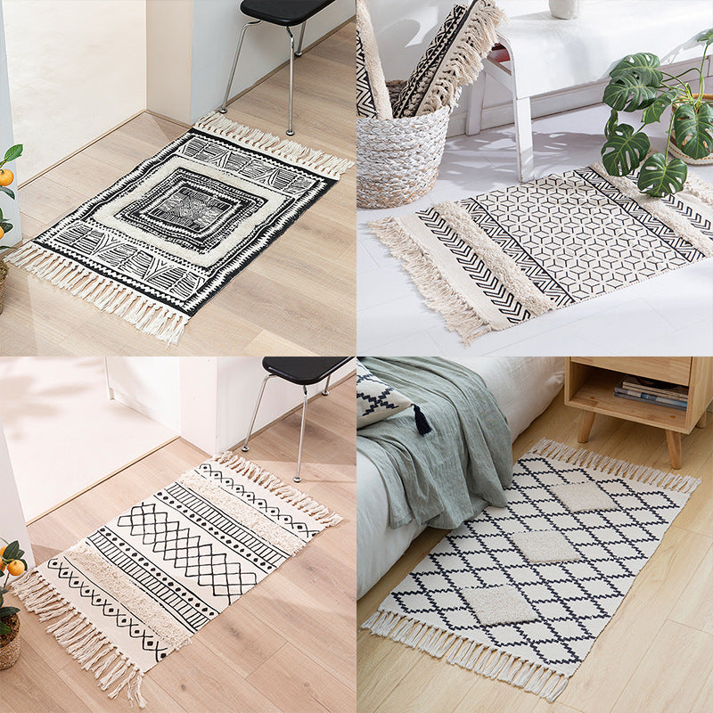 Flat Boho runner rug made of cotton blend fabric with geometric hexagon tufting and decorative fringed edge.