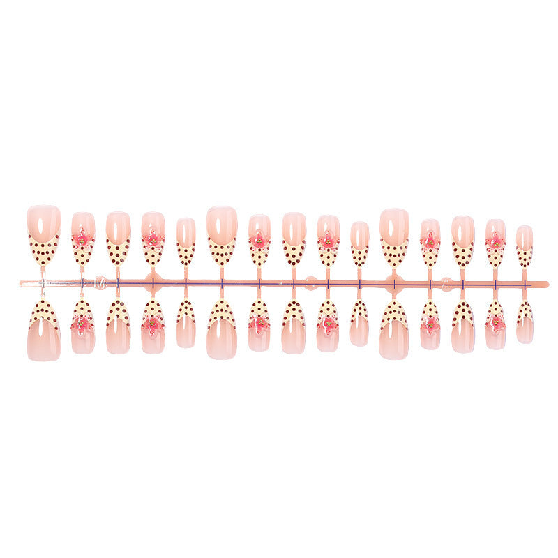 Acrylic nail set with romantic dots and floral accents Kalsten