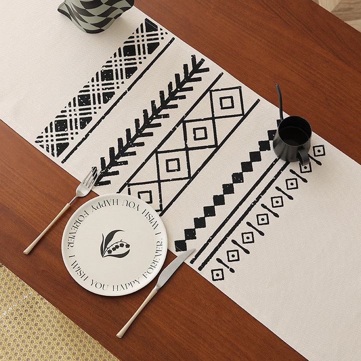 decorative table runner with geometric ethnic pattern and fringe