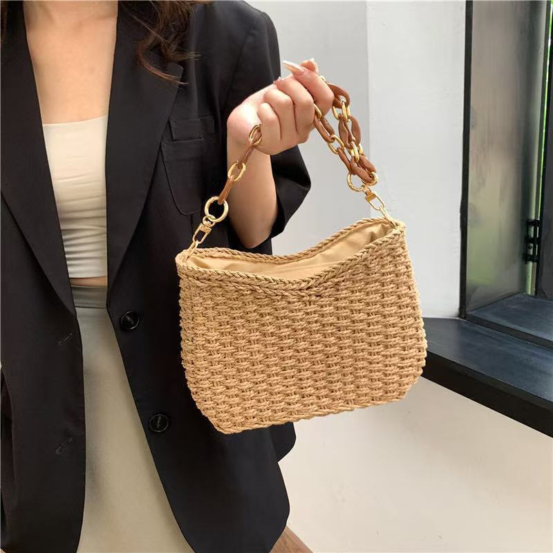 Handcrafted straw bag with golden chain details Kalsten