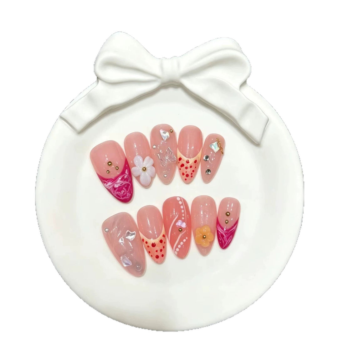 Artistic Press-On Nail Set with Floral and Decorative Elements