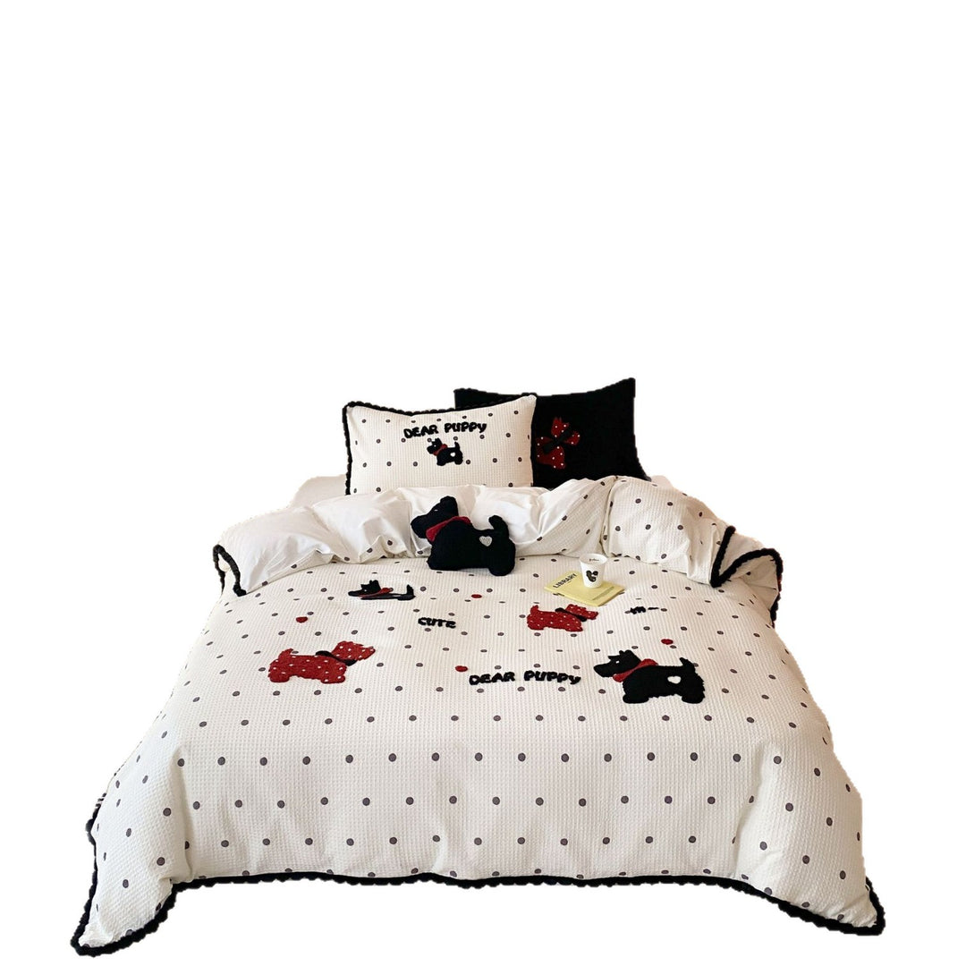 Quilted bedspread and pillow set with embroidered puppy motifs