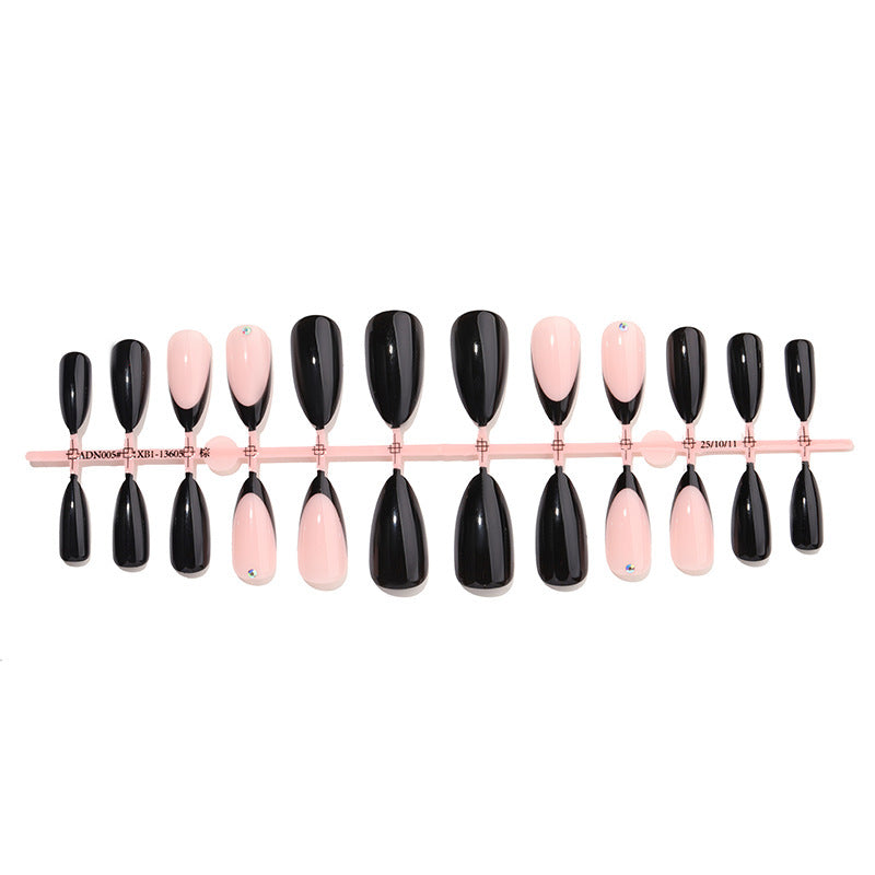 Acrylic nail set with elegant black-pink design and rhinestone-embellished accents Kalsten