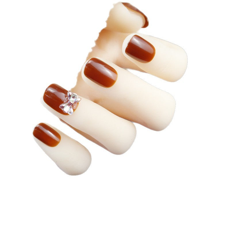 Elegant Press-On Nail Design with Rhinestone Accent