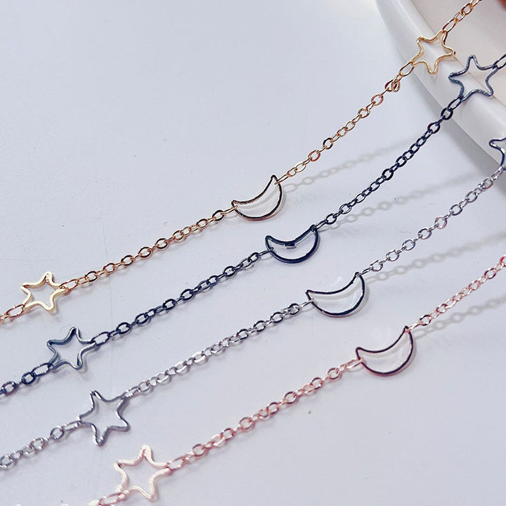 Fashionable glasses holder chain with star and moon motifs Kalsten