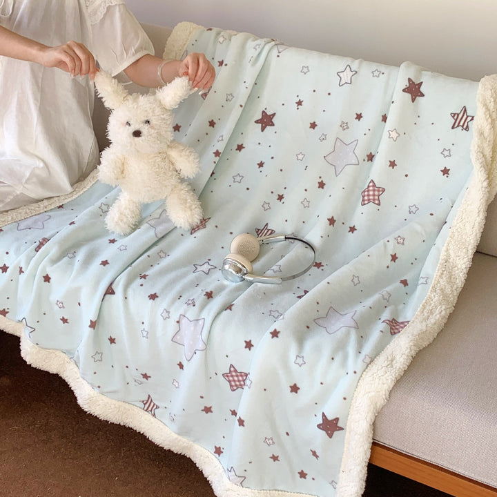 Reversible fleece blanket with cartoon cat design and teddy lining