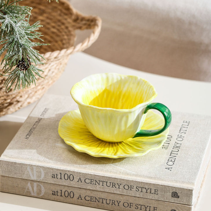 Ceramic mug with saucer in flower shape