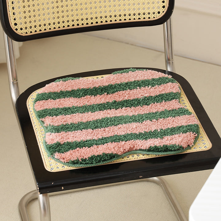 Shaped high pile bath mat with diagonal stripe structure