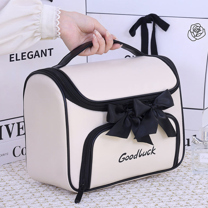 Cosmetic and toiletry bag with elegant bow accent Kalsten