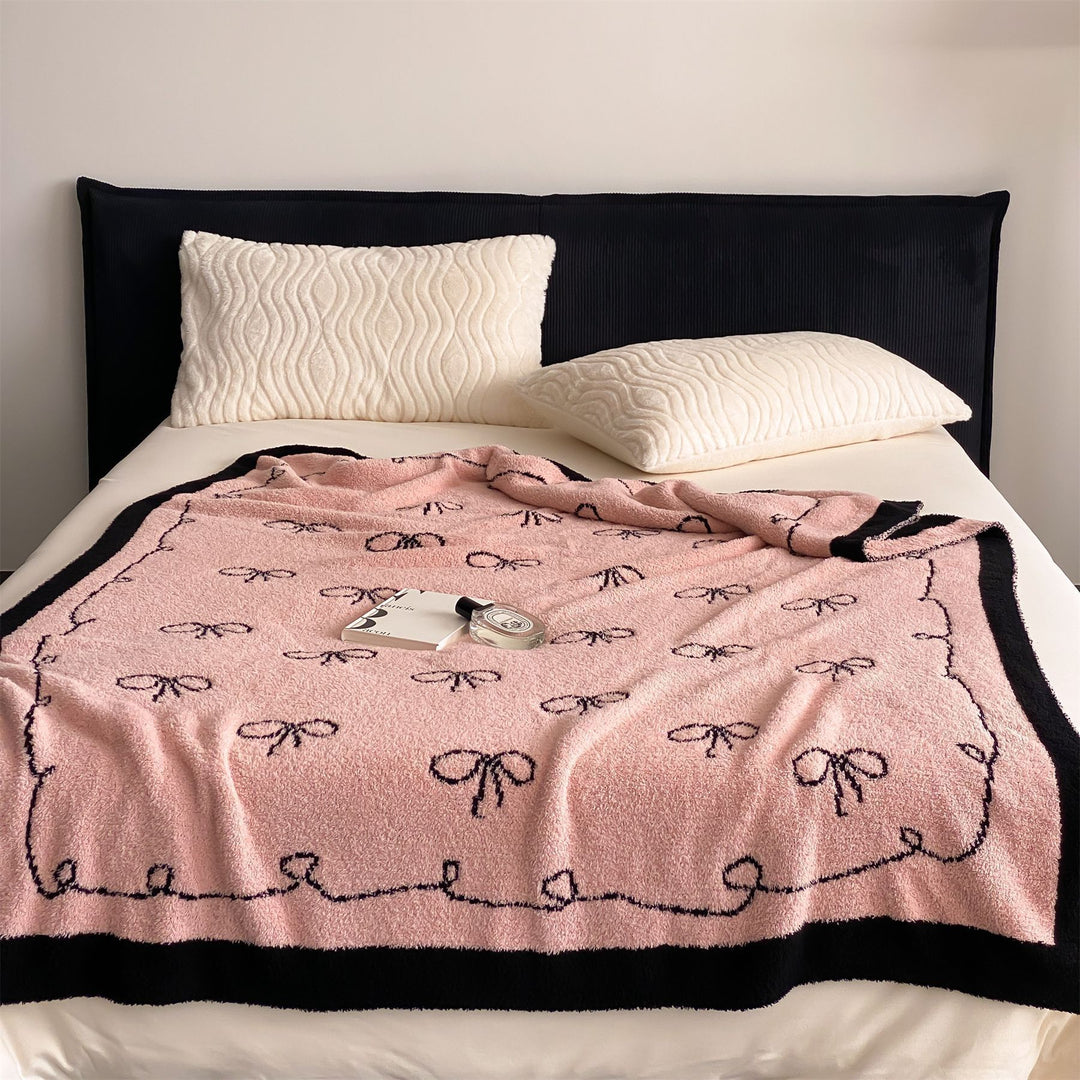 Reversible cuddly blanket made of terry cloth with decorative dog motif