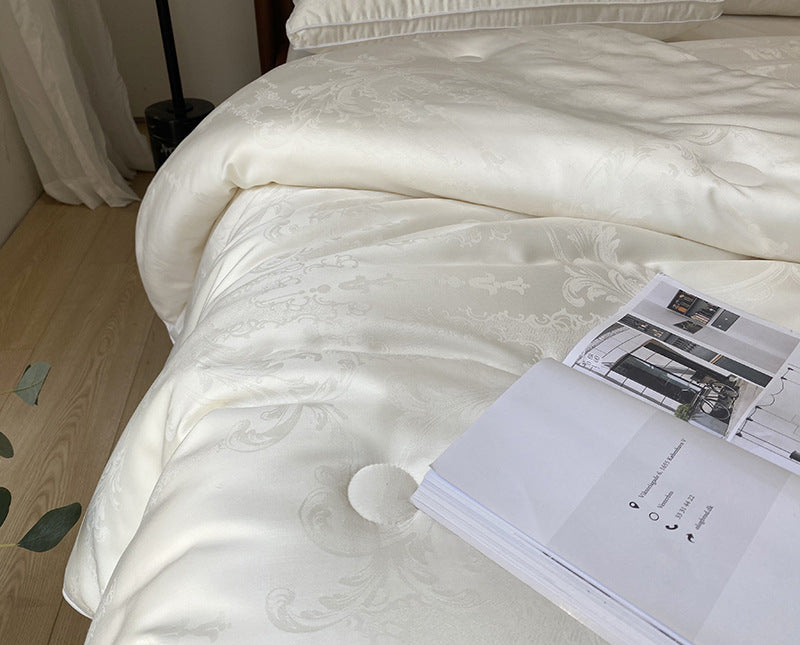 Extra light satin jacquard quilt with subtle button quilting