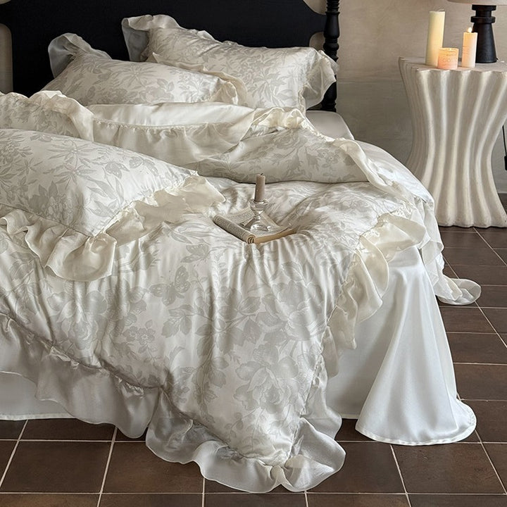 Elegant bedding set made of fine satin jacquard with delicate floral relief and decorative ruffle