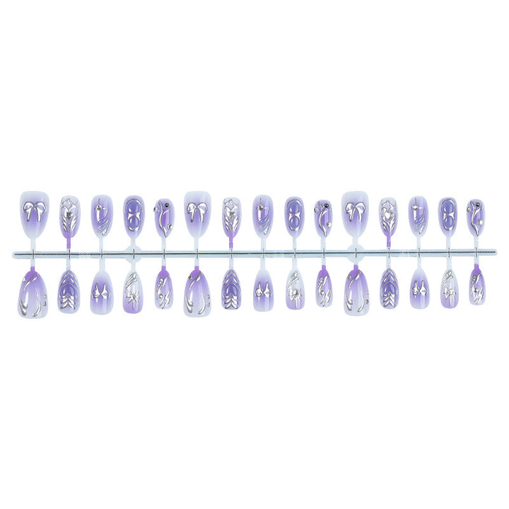 Acrylic nail set with elegant ombre design and delicate embellishments Kalsten