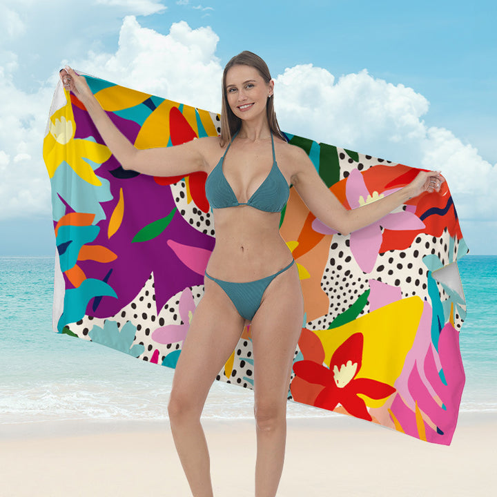 Beach towel with vibrant tropical plant motif Kalsten