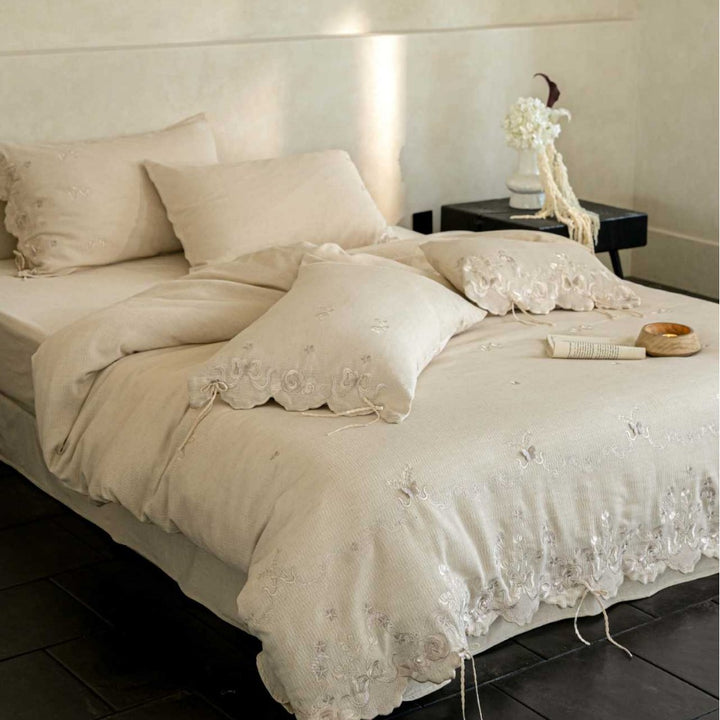 Luxurious embroidered linen bedding set with lace edge