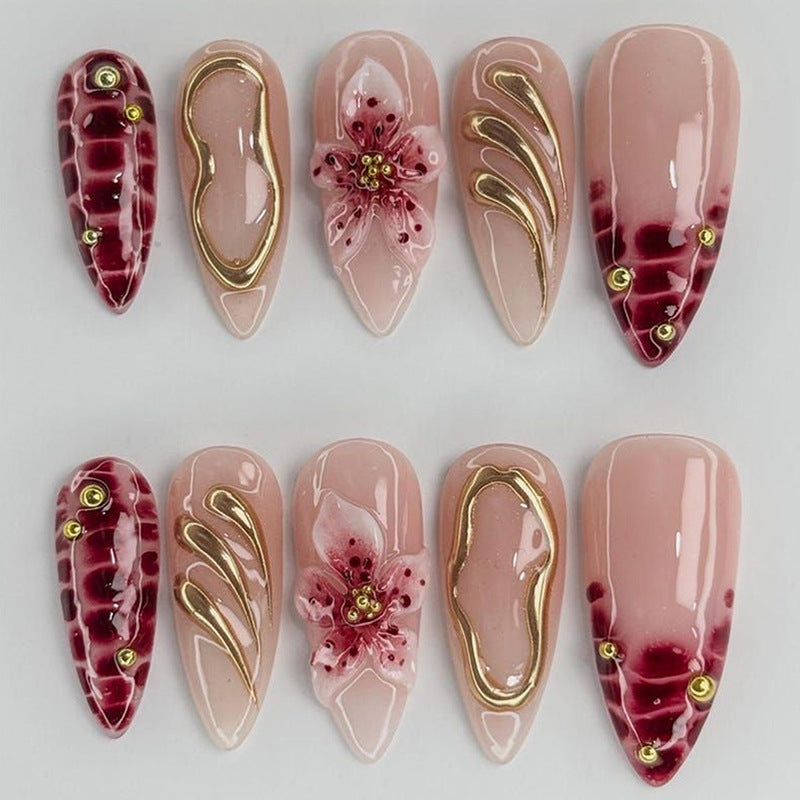 Creative nail art set with floral embellishments and glamorous accents Kalsten