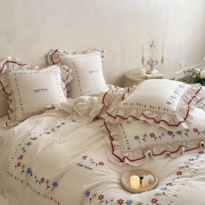 Boho-inspired bedding set made of organic cotton with ruffle and floral embroidery