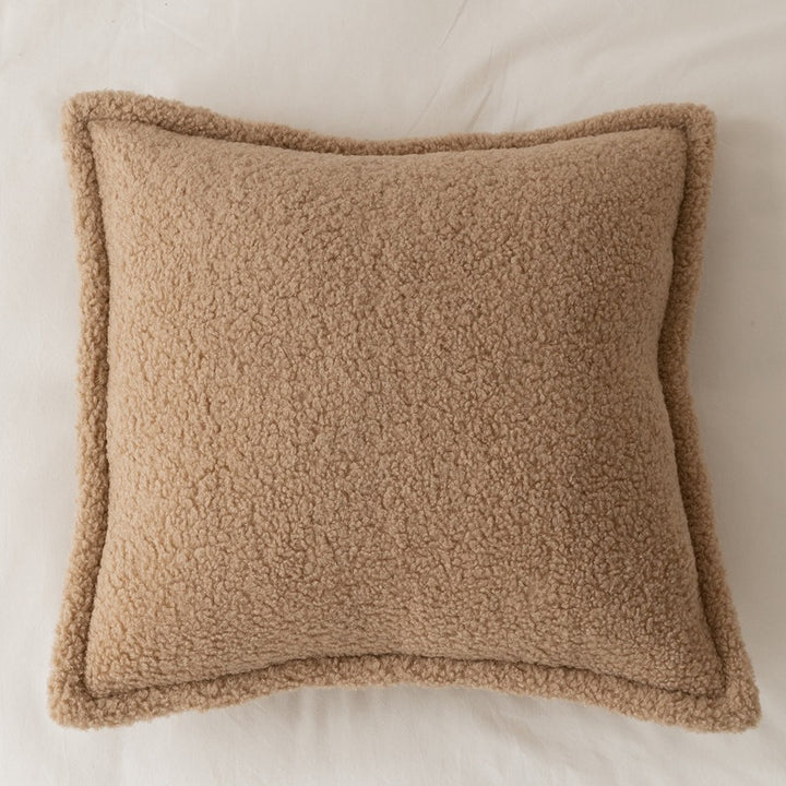 Decorative teddy fleece cushion with padded filling and piped seam